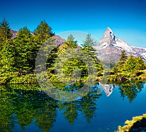 Ð¢ÑˆÑÑƒ summer morning on the Grindjisee lake. Peaceful view of  Matterhorn Monte Cervino, Mont Cervin peak, Swiss Alps,